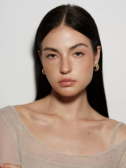 Hollowed-out four-leaf clover earrings