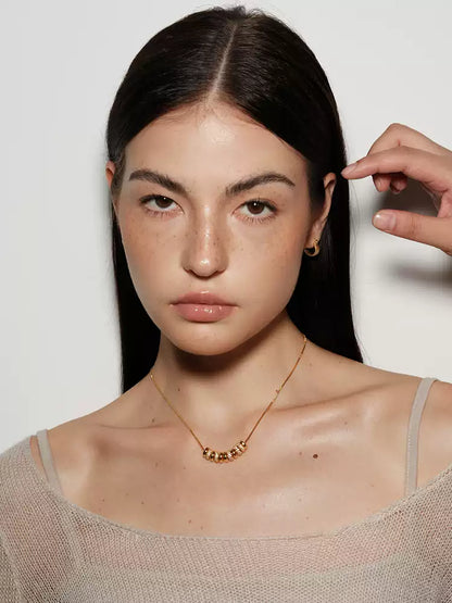 18k gold plated flat bead with diamond inlay necklace